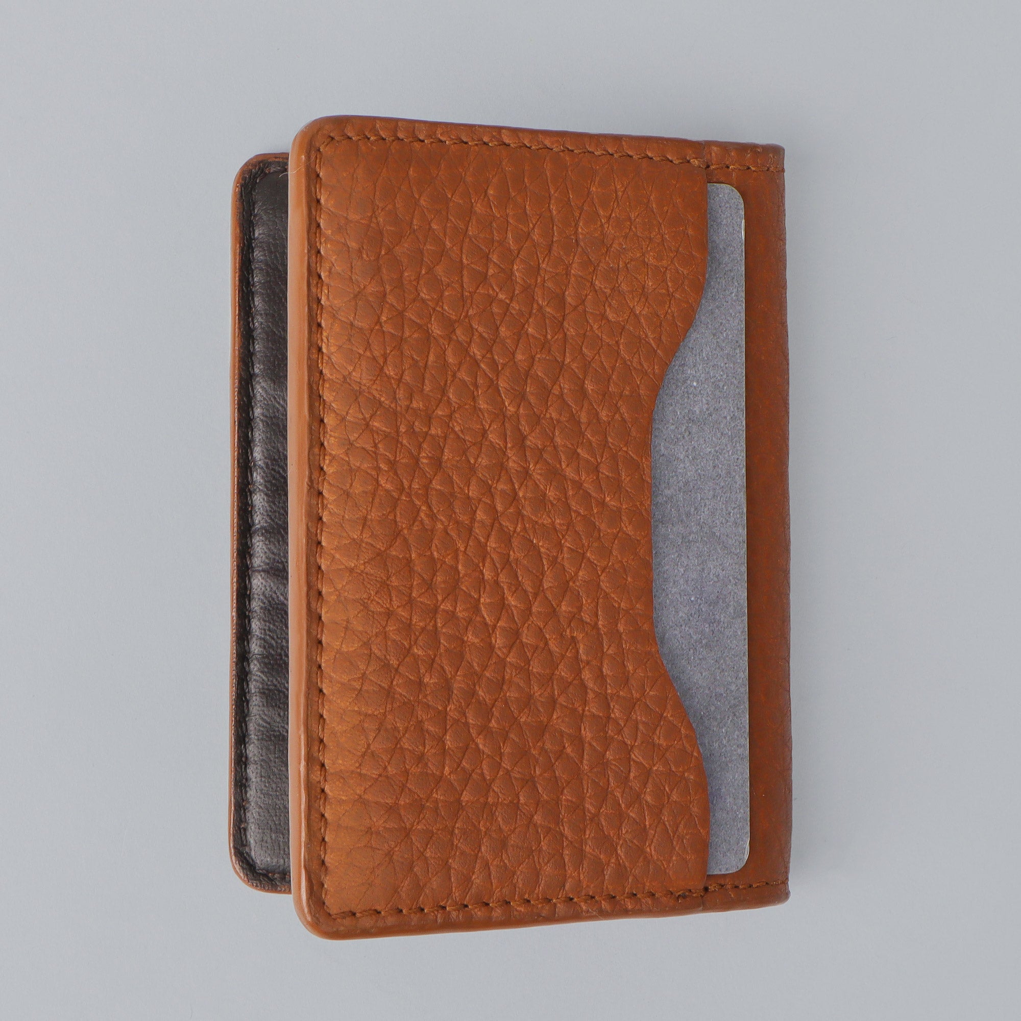 A stylish Business Cards Leather Wallet made from premium full grain leather, featuring multiple pockets for business cards and a sleek design.