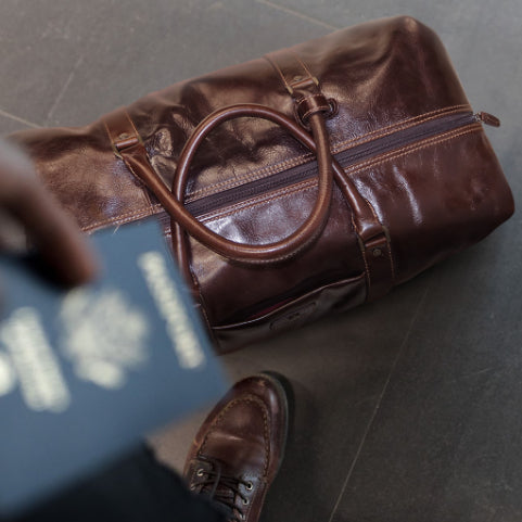 Cabin Wheeled Holdall 55cm in Tobacco color, showcasing its stylish design and durable wheels.