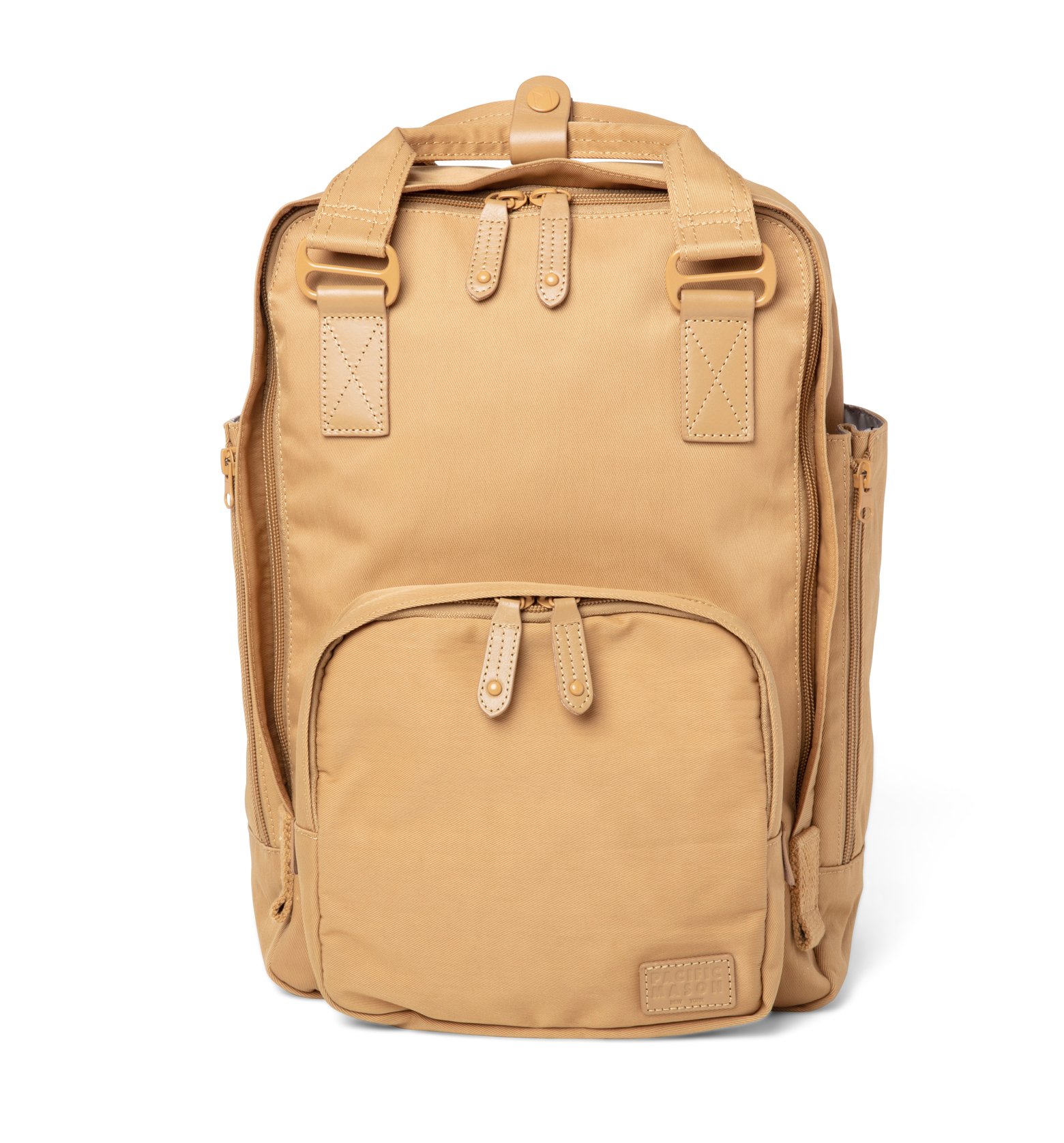 Cama (M) Caramel backpack featuring oversized square shape, water-repellent nylon, and leather accents.