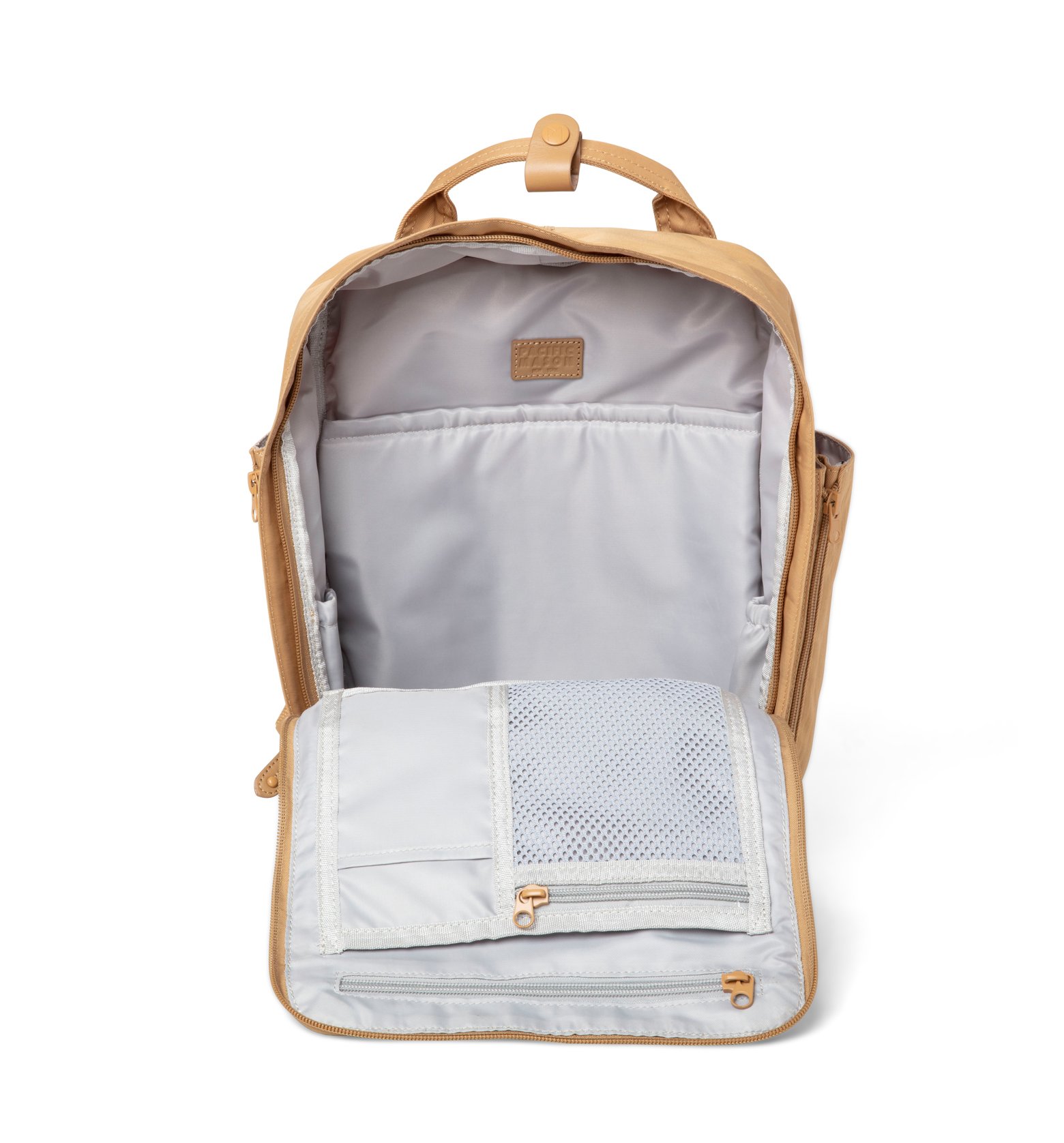 Cama (M) Caramel backpack featuring oversized square shape, water-repellent nylon, and leather accents.