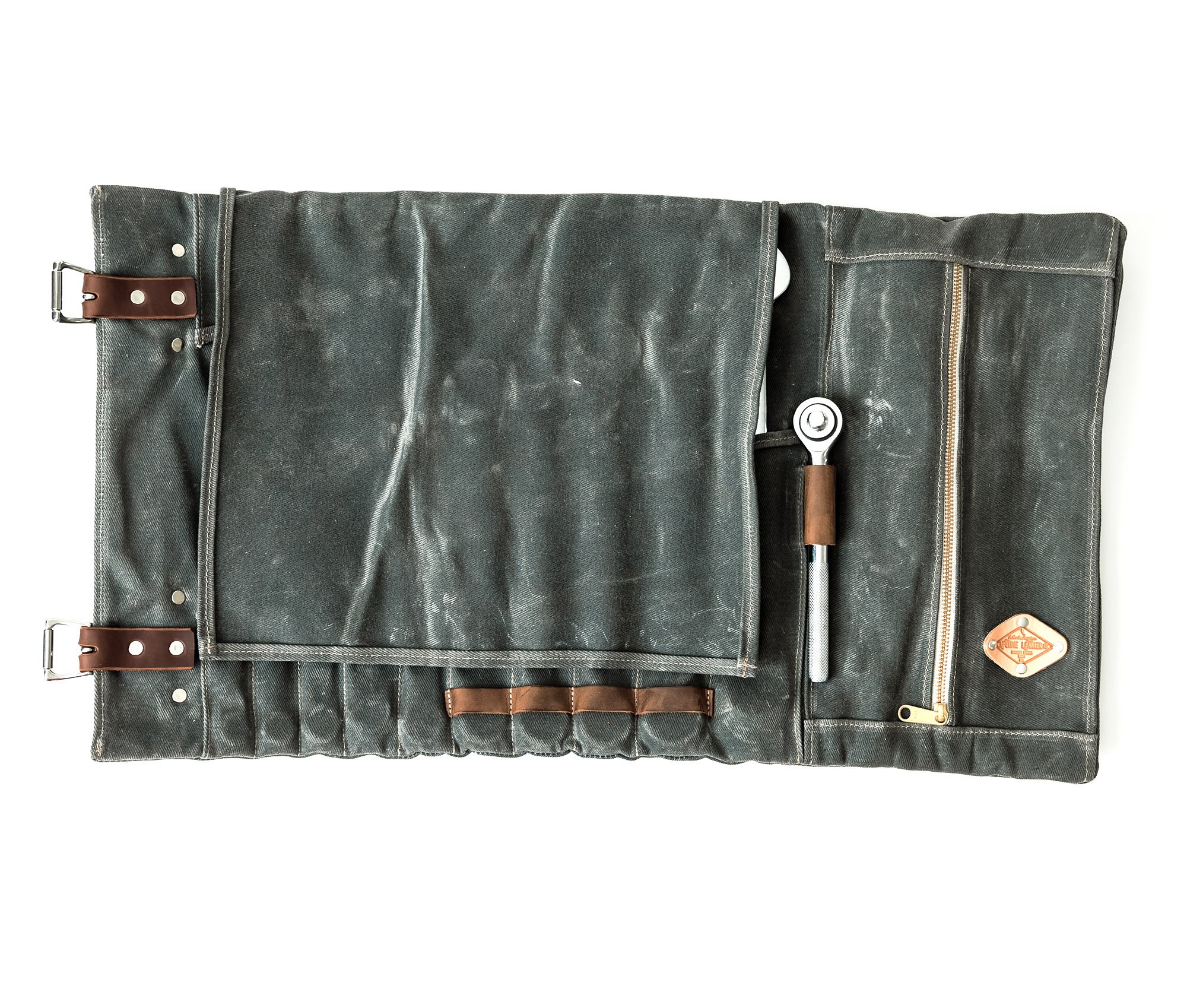 Canvas Tool Roll featuring waxed canvas and leather accents, designed to hold wrenches and tools securely.