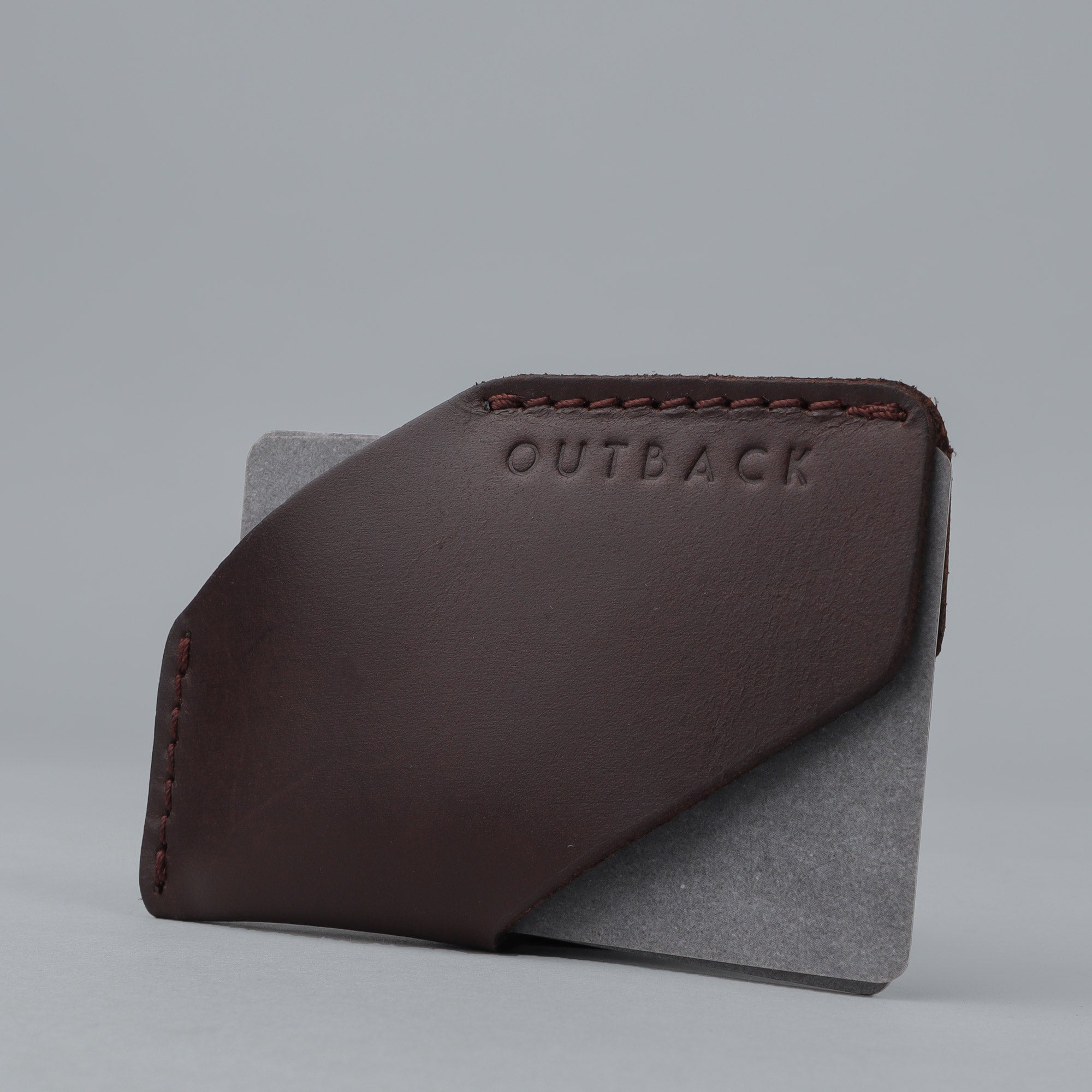 Elegant handcrafted leather Cards Sleeve holding credit cards and IDs, showcasing its durable design and unique patina.