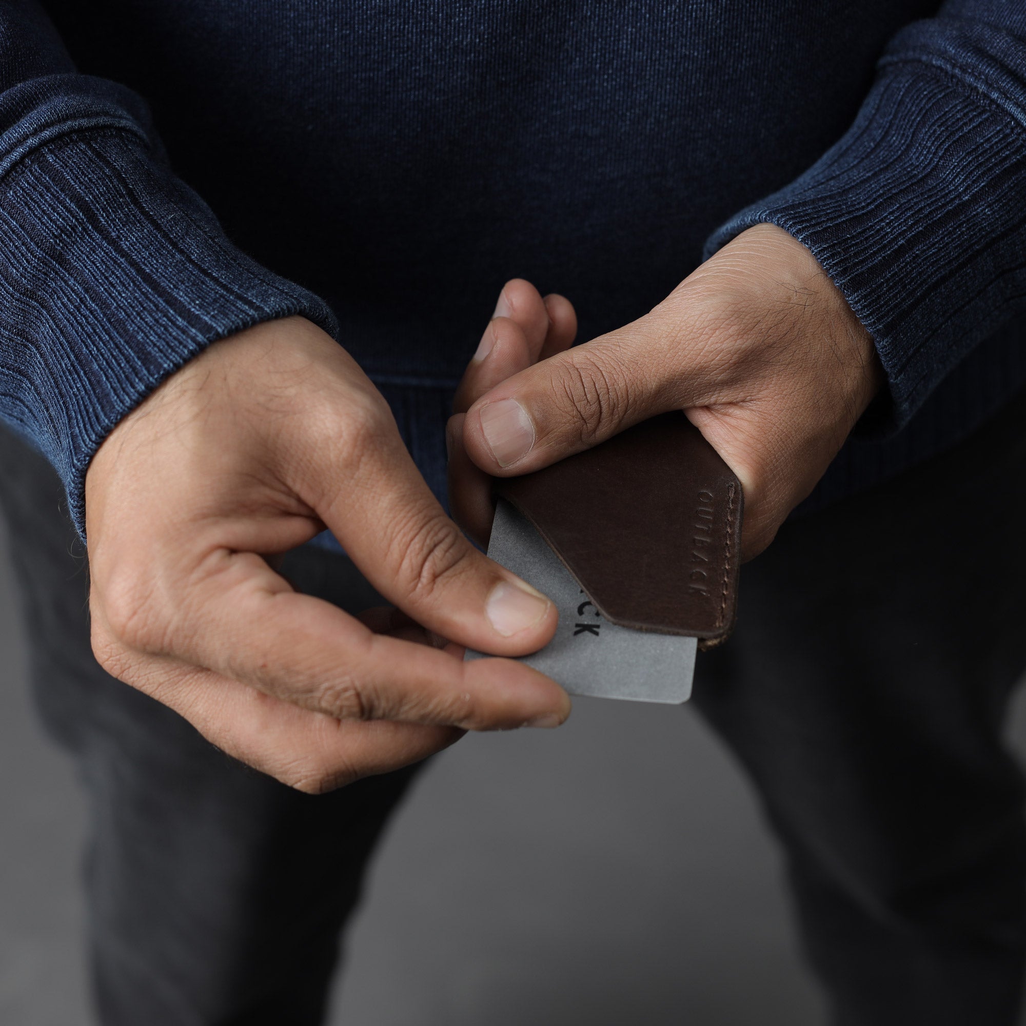 Elegant handcrafted leather Cards Sleeve holding credit cards and IDs, showcasing its durable design and unique patina.