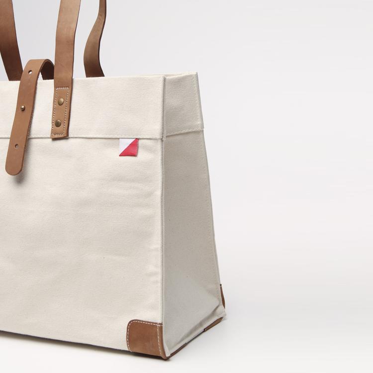 Carmel Tote Bag featuring heavyweight canvas and thick leather handles, designed for outdoor gatherings.