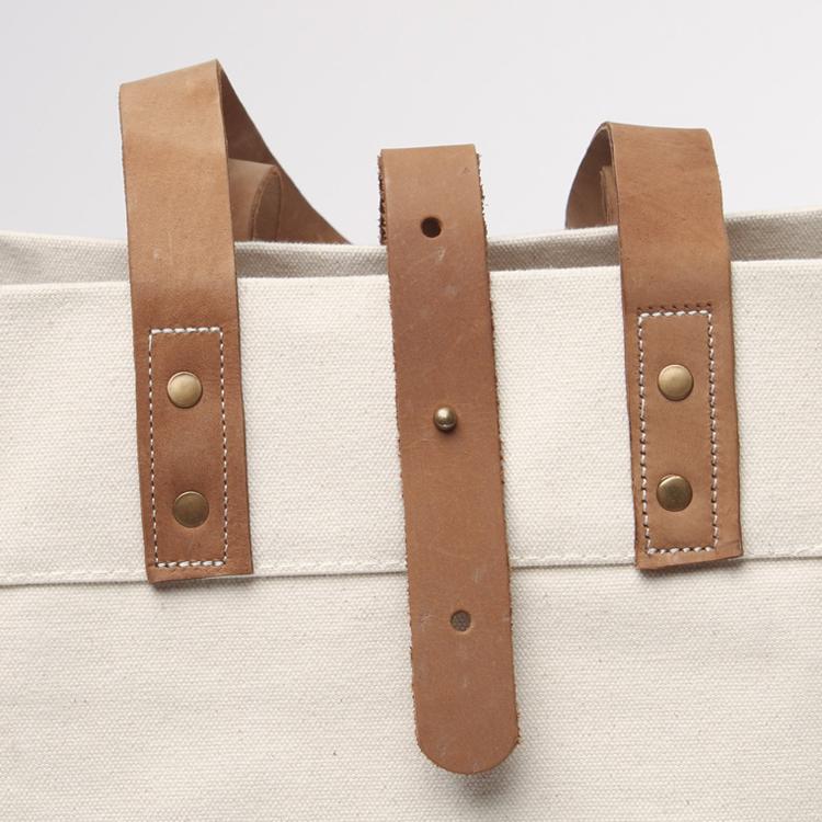 Carmel Tote Bag featuring heavyweight canvas and thick leather handles, designed for outdoor gatherings.