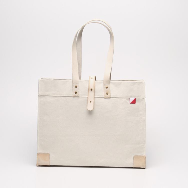 Carmel Tote Bag featuring heavyweight canvas and thick leather handles, designed for outdoor gatherings.