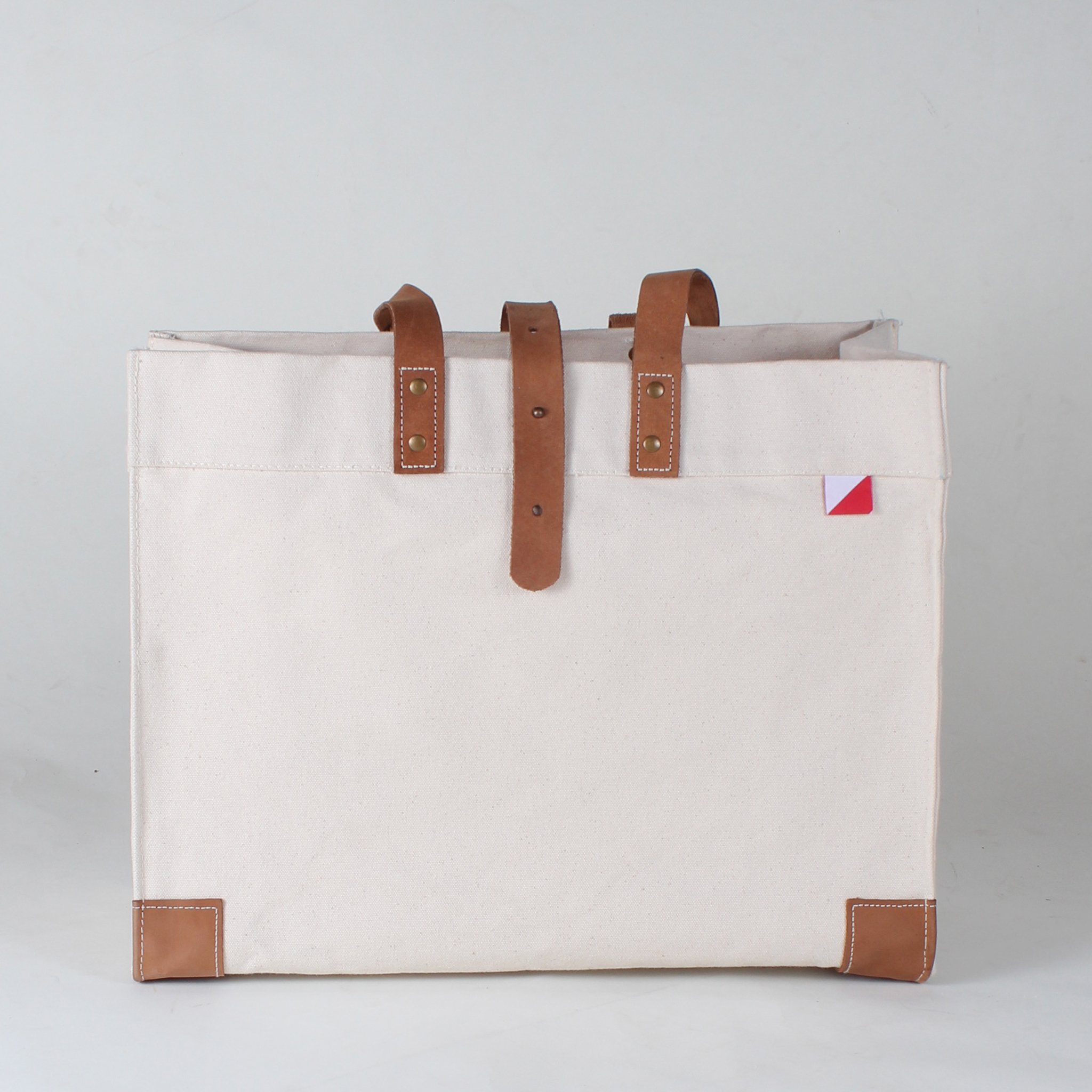 Carmel Tote Bag featuring heavyweight canvas and thick leather handles, designed for outdoor gatherings.