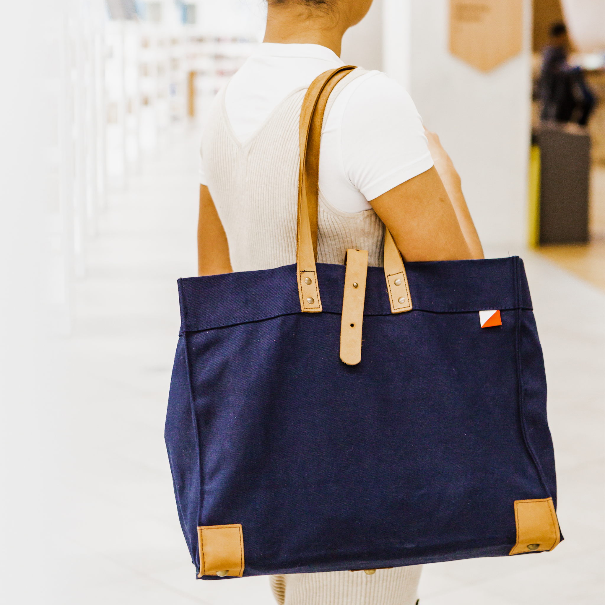 Carmel Tote Bag featuring heavyweight canvas and thick leather handles, designed for outdoor gatherings.