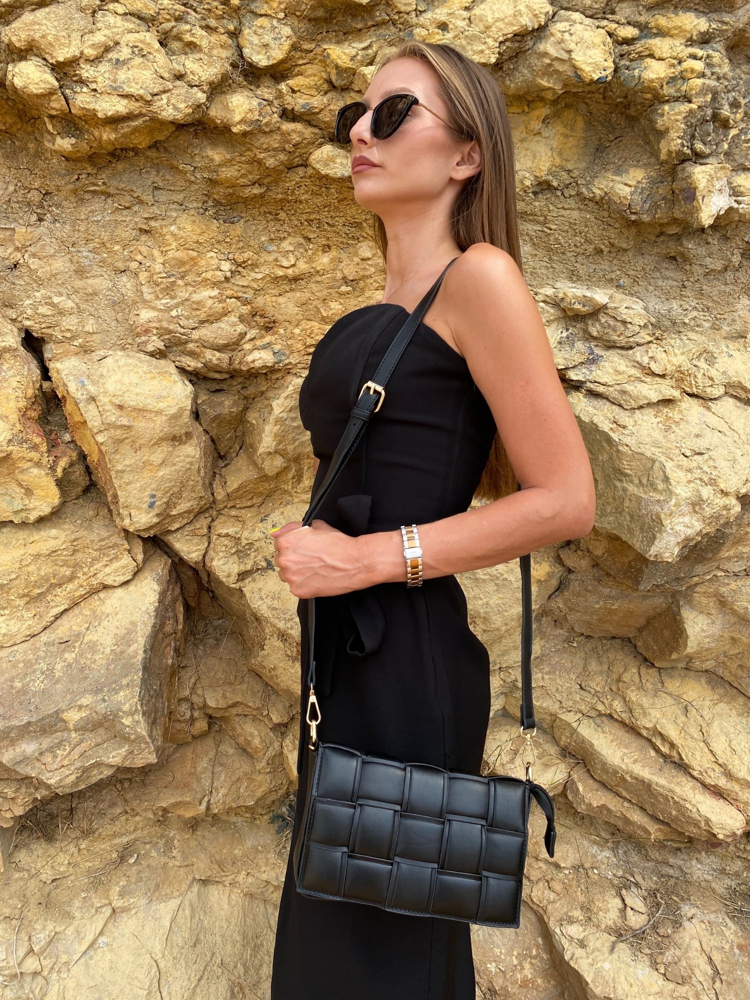 Stylish black Cassette Shoulder Bag with quilted flap and adjustable strap, showcasing its elegant design and functional features.