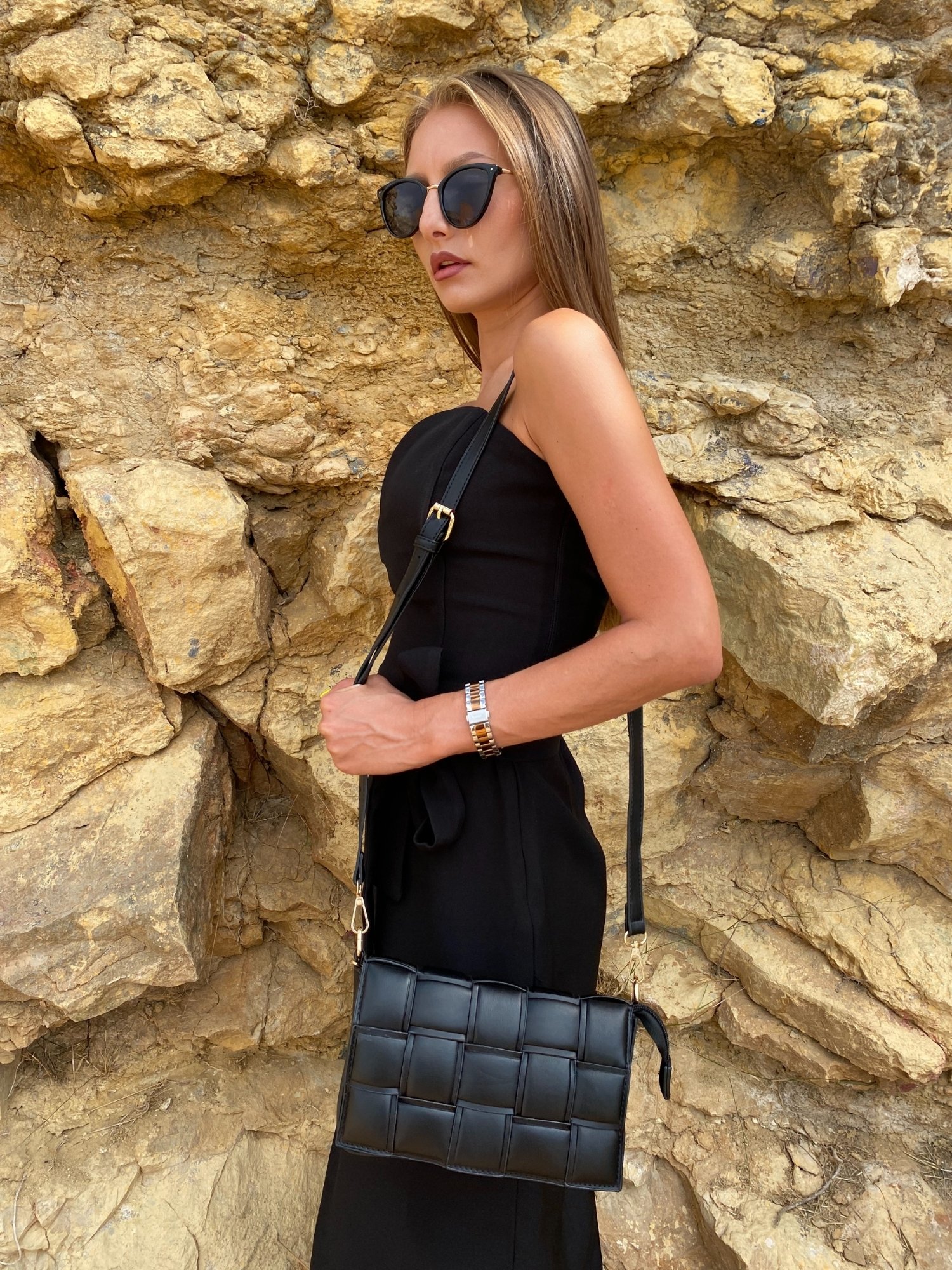 Stylish black Cassette Shoulder Bag with quilted flap and adjustable strap, showcasing its elegant design and functional features.