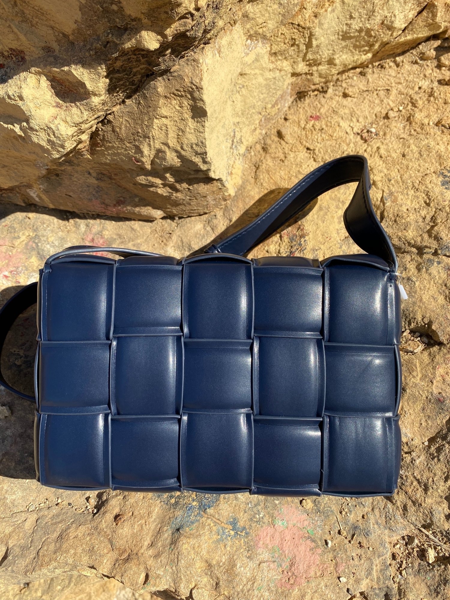 Blue Cassette Shoulder Bag with quilted flap and adjustable strap, featuring a lined interior and magnetic closure.