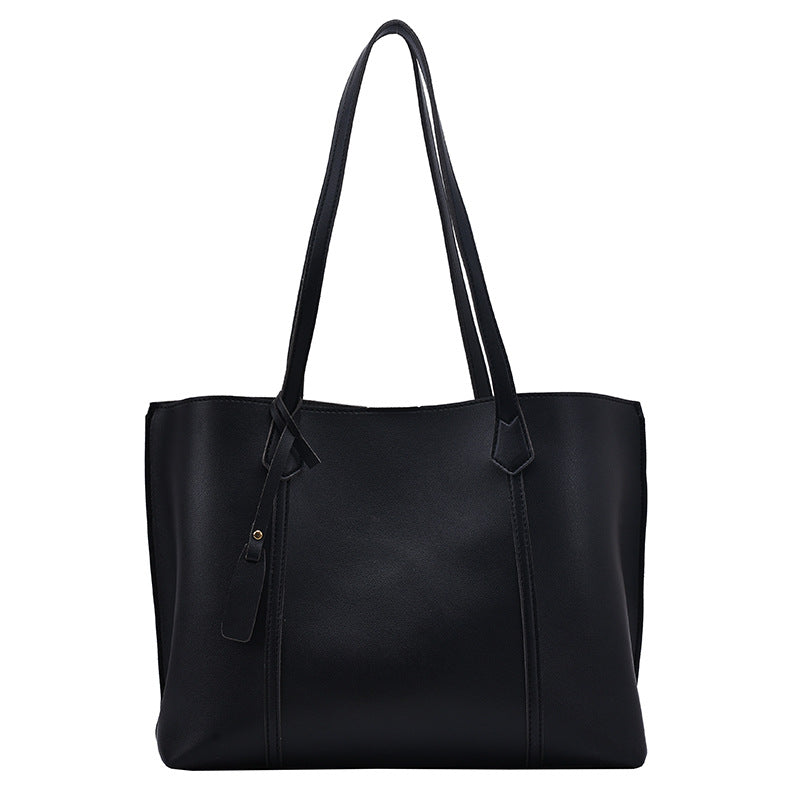 A stylish Casual All-match One-shoulder Handbag for Women made of soft PU fabric, featuring a horizontal square shape and a magnetic button closure.