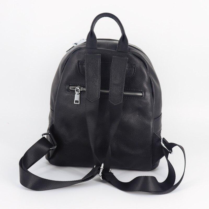 Chic Black Leather Backpack made from genuine cow leather, featuring a sleek design with multiple pockets and a soft handle.