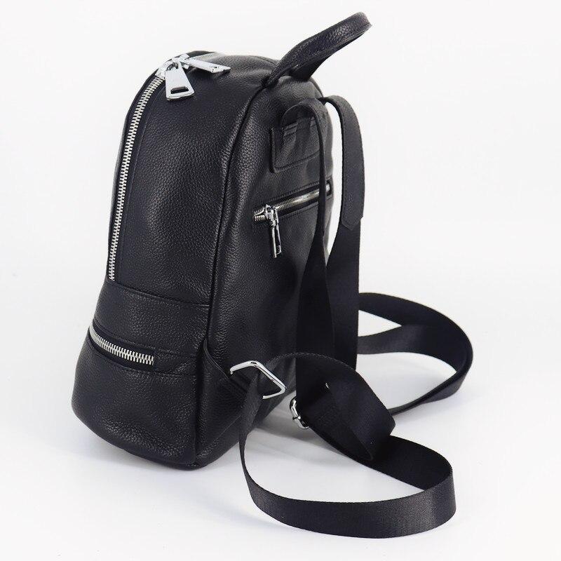 Chic Black Leather Backpack made from genuine cow leather, featuring a sleek design with multiple pockets and a soft handle.