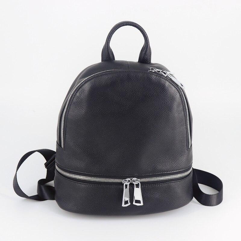 Chic Black Leather Backpack made from genuine cow leather, featuring a sleek design with multiple pockets and a soft handle.