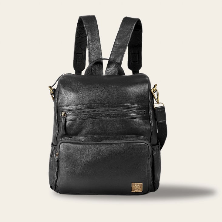 Classic leather backpack made from top-grain hides, showcasing its stylish design and spacious interior.