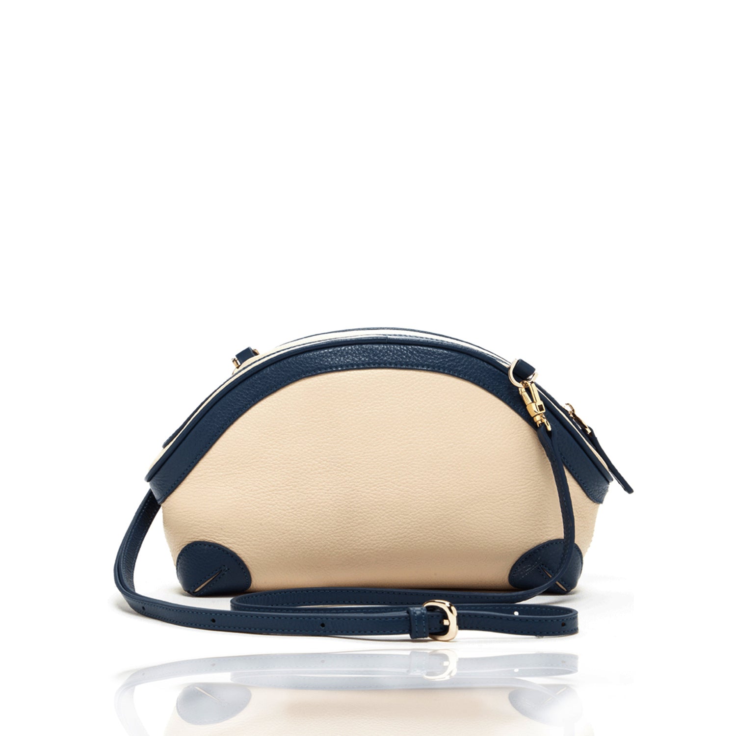 Coco Ivory Leather Crossbody Bag featuring pebbled texture, gold hardware, and adjustable strap.