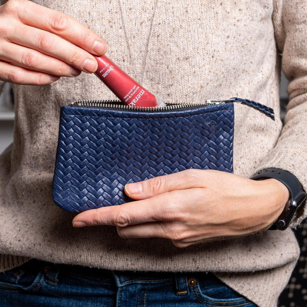 Coffer Mini Handwoven Leather Zipper Clutch in Blue, showcasing its elegant design and natural leather texture.