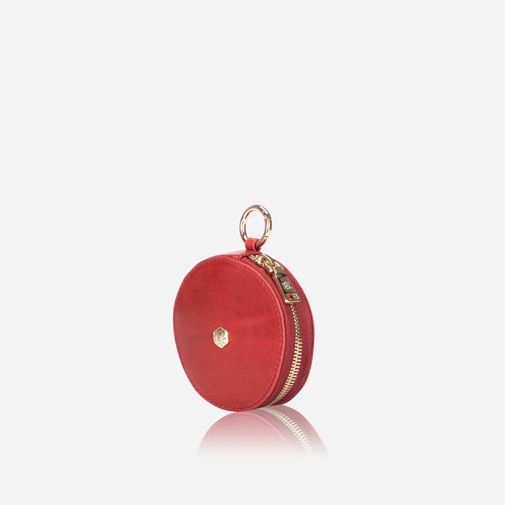 A vibrant red coin purse designed to hold coins, cards, and notes, featuring a compact and stylish design.