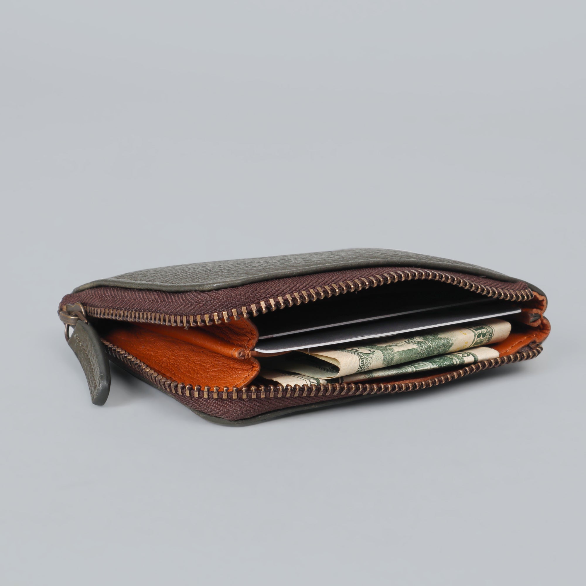 A stylish Coins Wallet made from durable harness leather, featuring a zipper closure and multiple pockets for coins and cards.