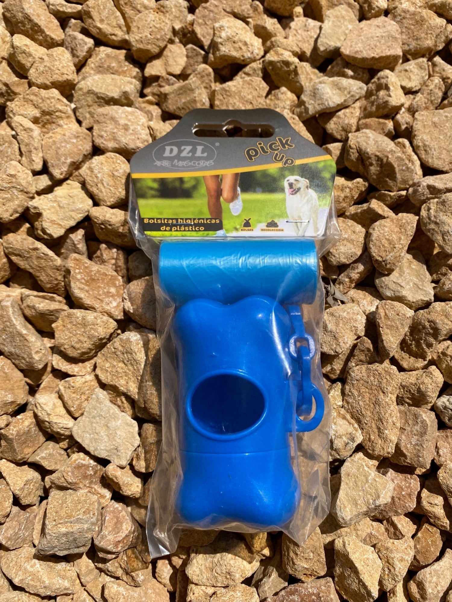 Colored Poop Bag Dispenser in Blue, Black, and Green with attached poop bags, showcasing its practical design and carabiner clip.