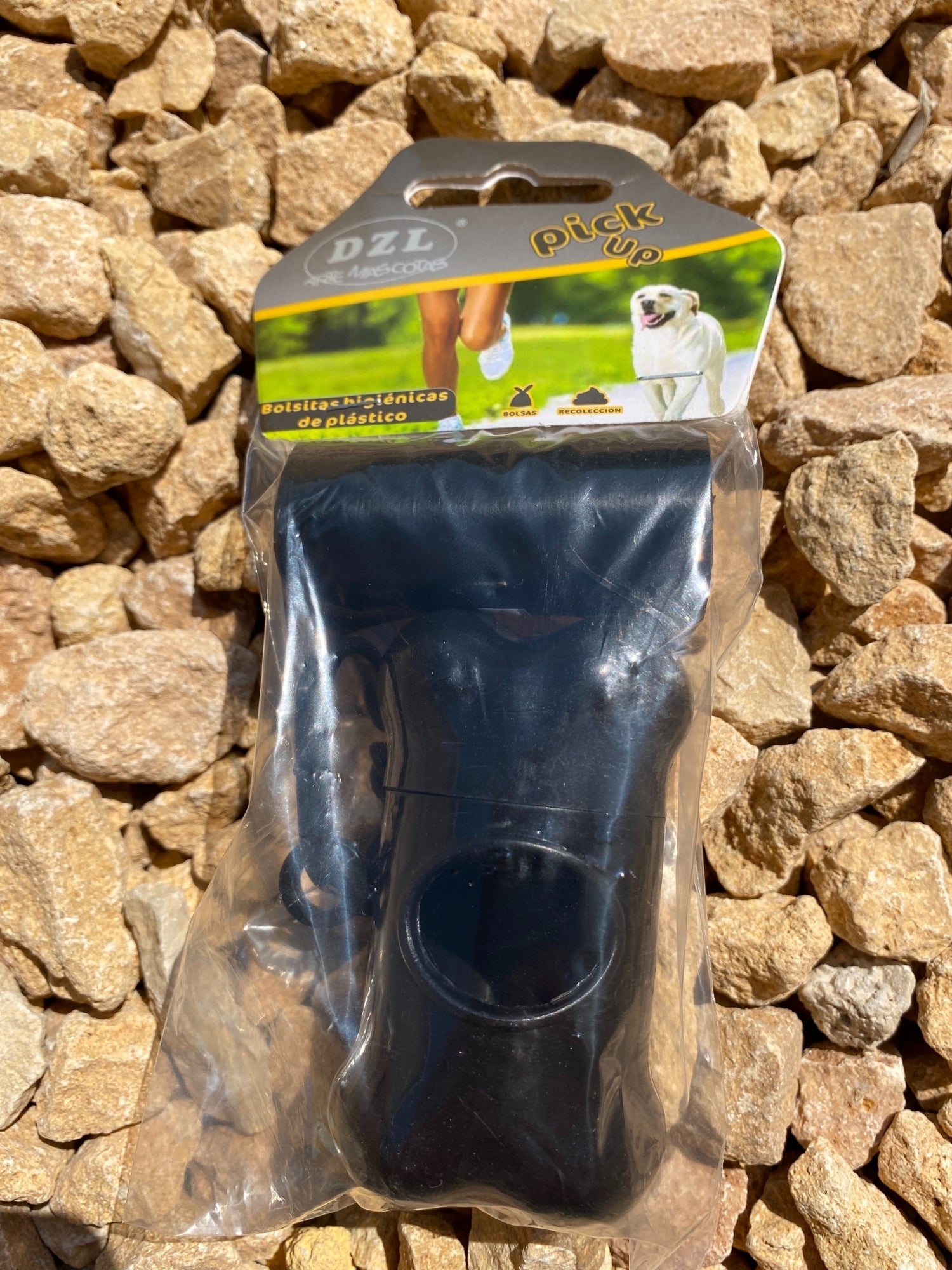 Colored Poop Bag Dispenser in Blue, Black, and Green with attached poop bags, showcasing its practical design and carabiner clip.