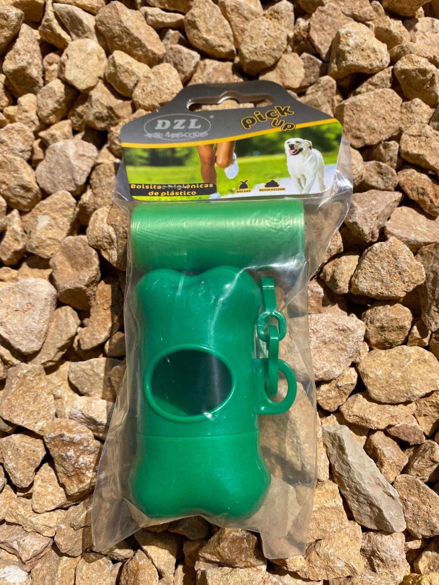 Colored Poop Bag Dispenser in Blue, Black, and Green with attached poop bags, showcasing its practical design and carabiner clip.