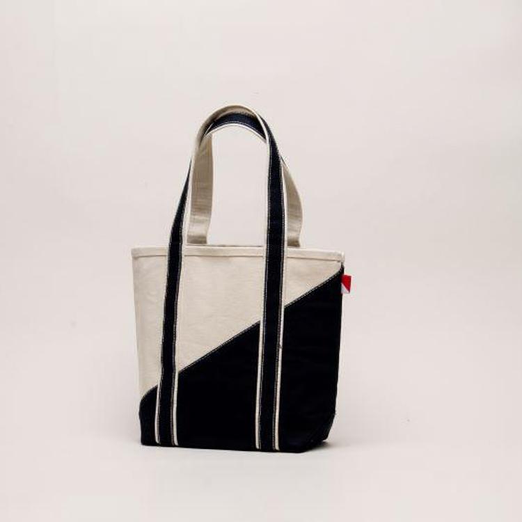 A stylish Contemporary Tote Bag Mini in vibrant colors, showcasing its durable construction and compact design, perfect for gifts and everyday use.