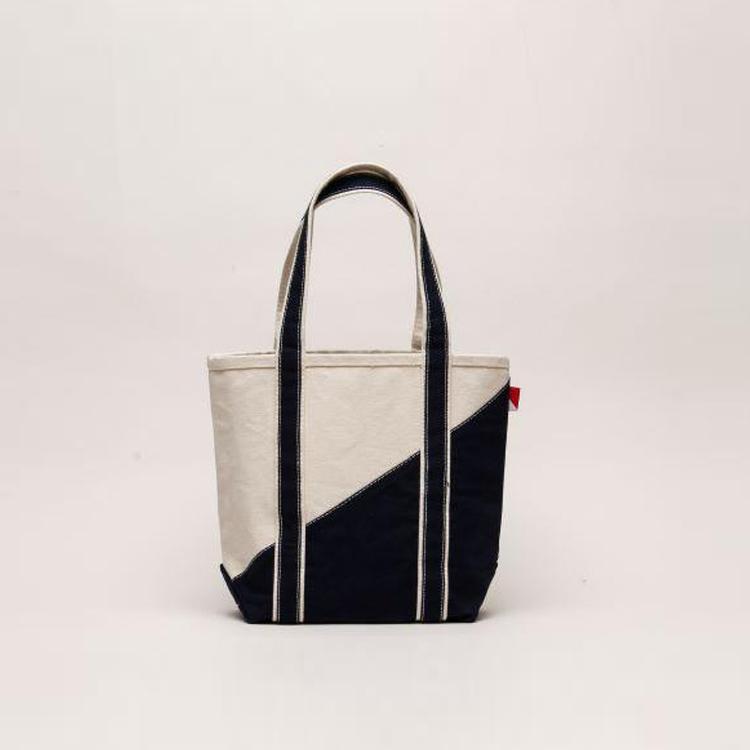 A stylish Contemporary Tote Bag Mini in vibrant colors, showcasing its durable construction and compact design, perfect for gifts and everyday use.