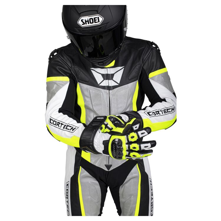 Cortech Apex V1 Race Suit showcasing durable cowhide leather, perforated zones, and protective armor features.