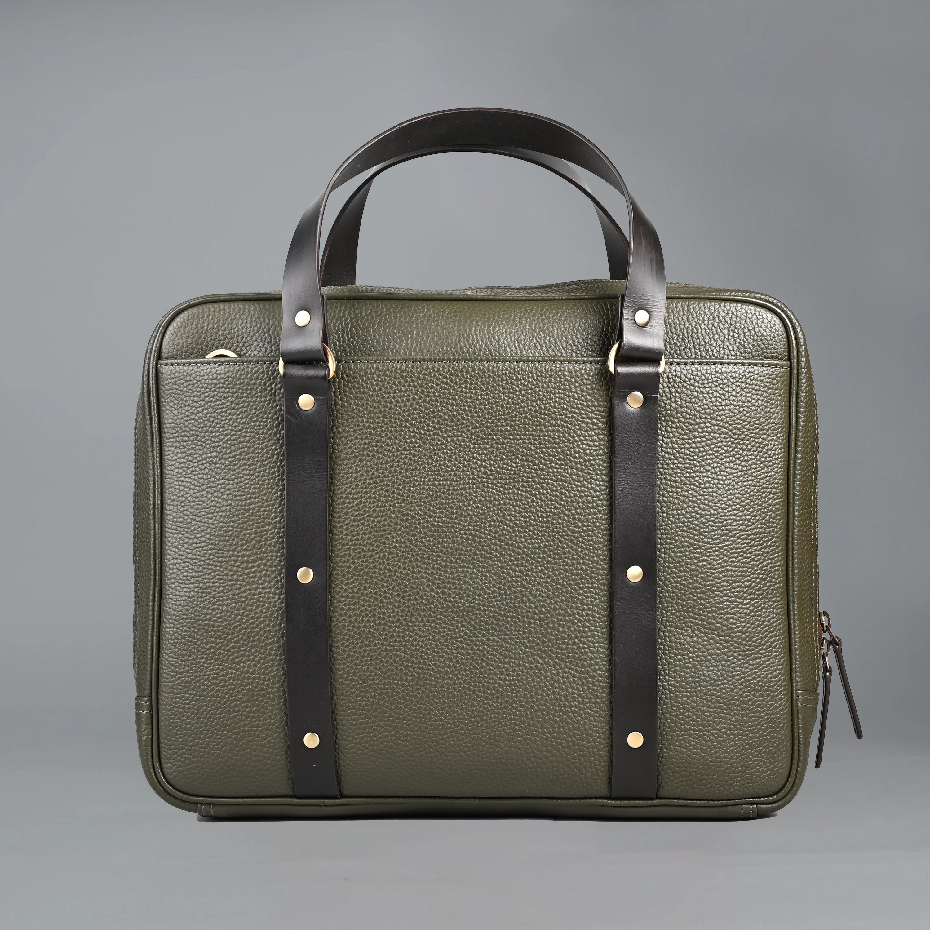 The Creek Briefcase made from premium leather, featuring a padded laptop section and multiple storage pockets.