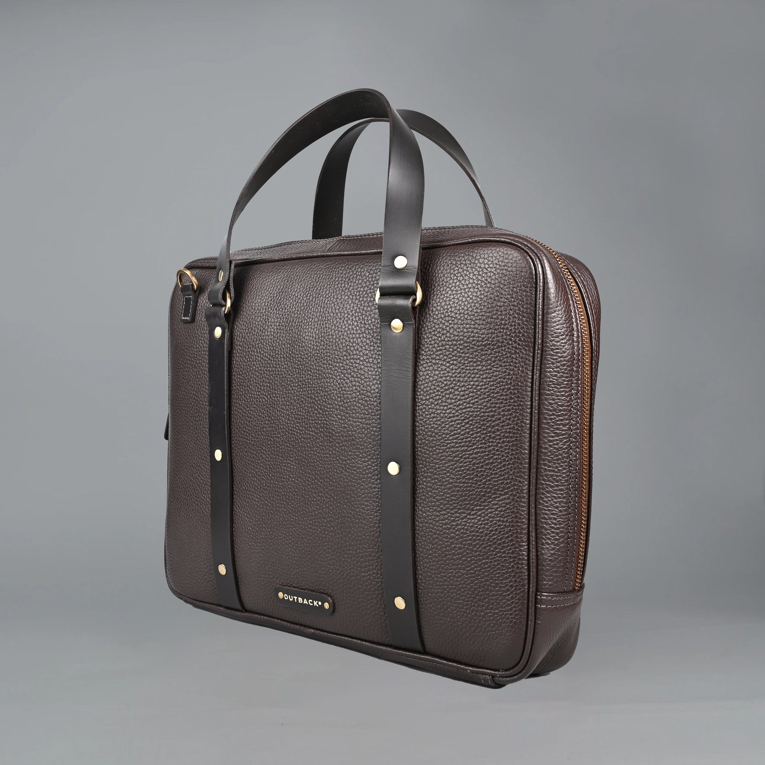 The Creek Briefcase made from premium leather, featuring a padded laptop compartment and multiple storage pockets.