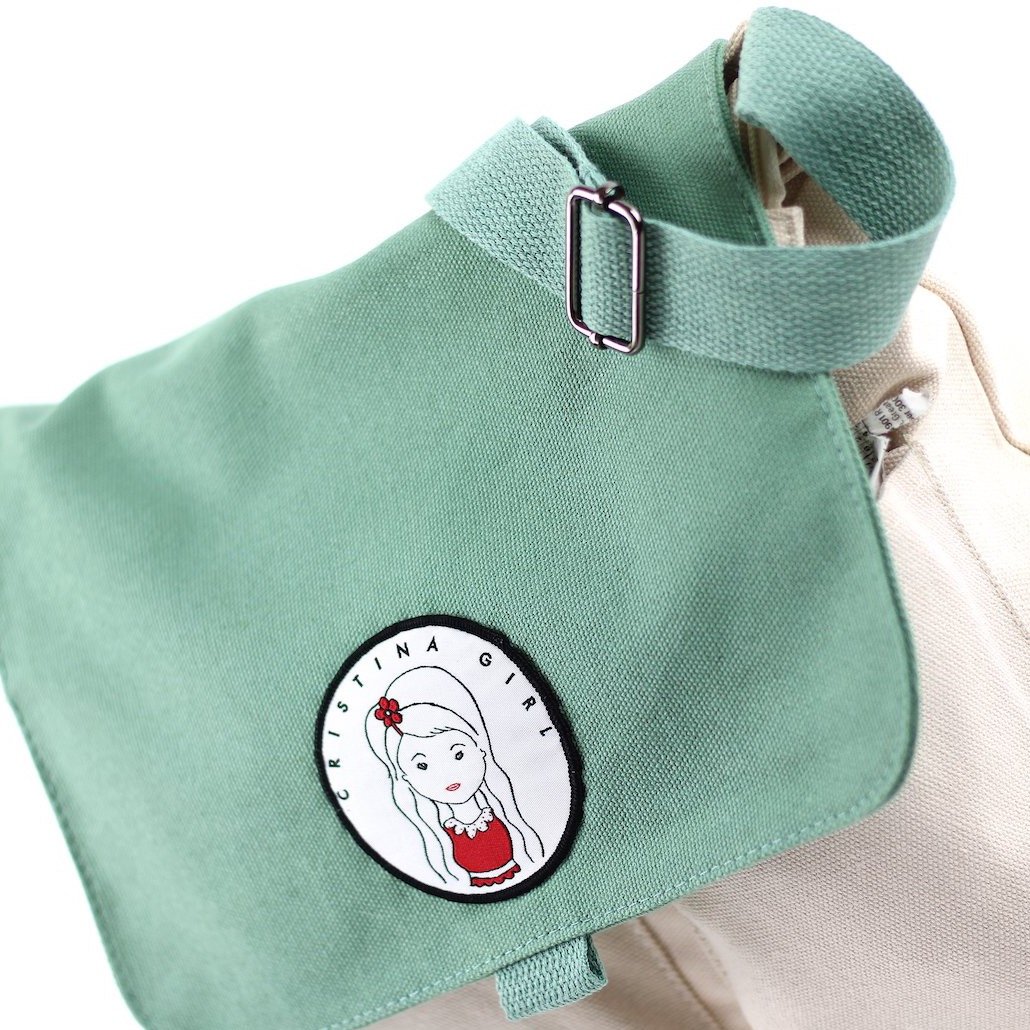 Stylish two-tone cross body bag made of durable canvas, featuring adjustable strap and multiple pockets.