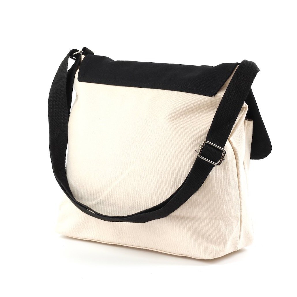 Stylish two-tone cross body bag made of durable canvas, featuring adjustable strap and multiple pockets.