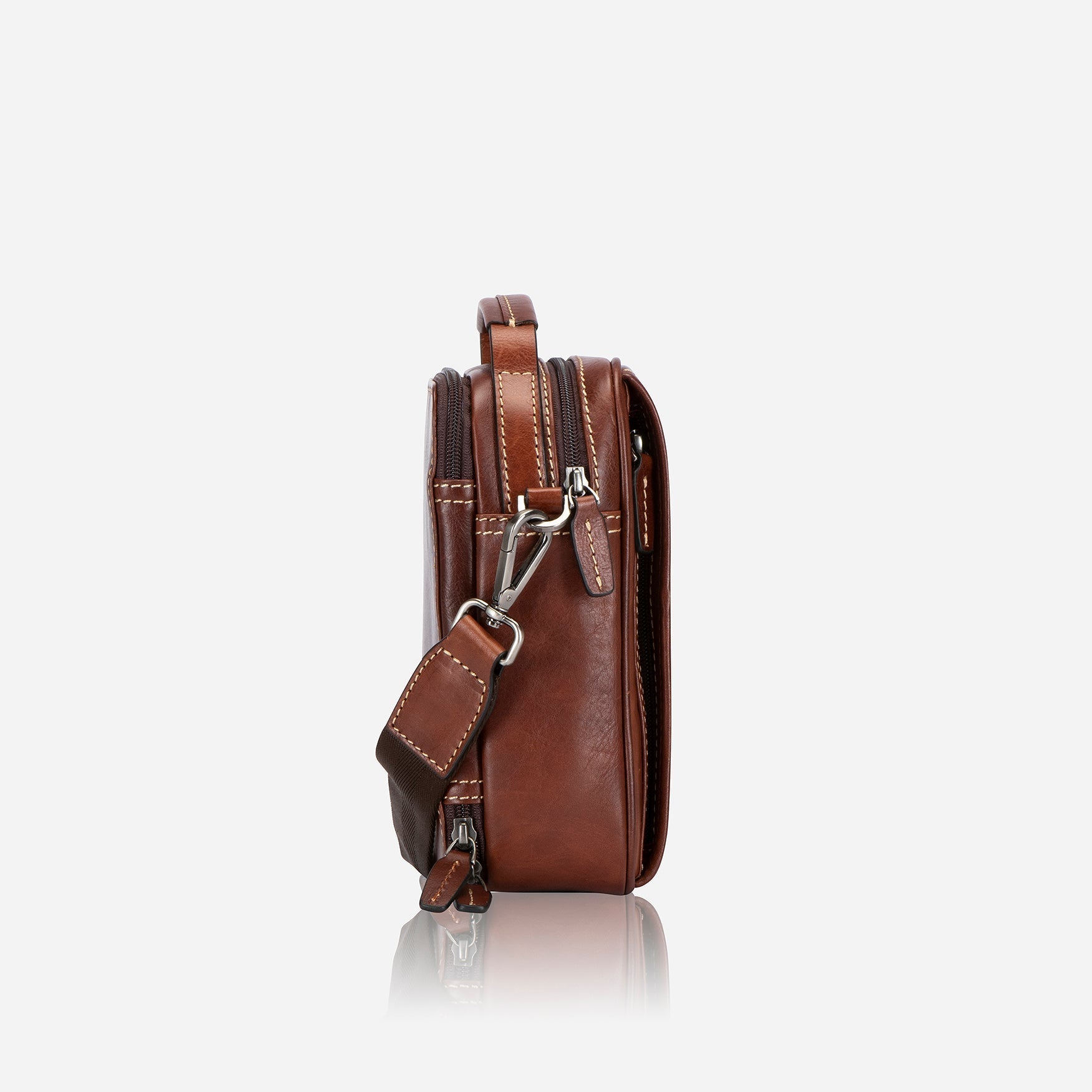 Stylish tobacco crossbody bag with adjustable strap and spacious interior.