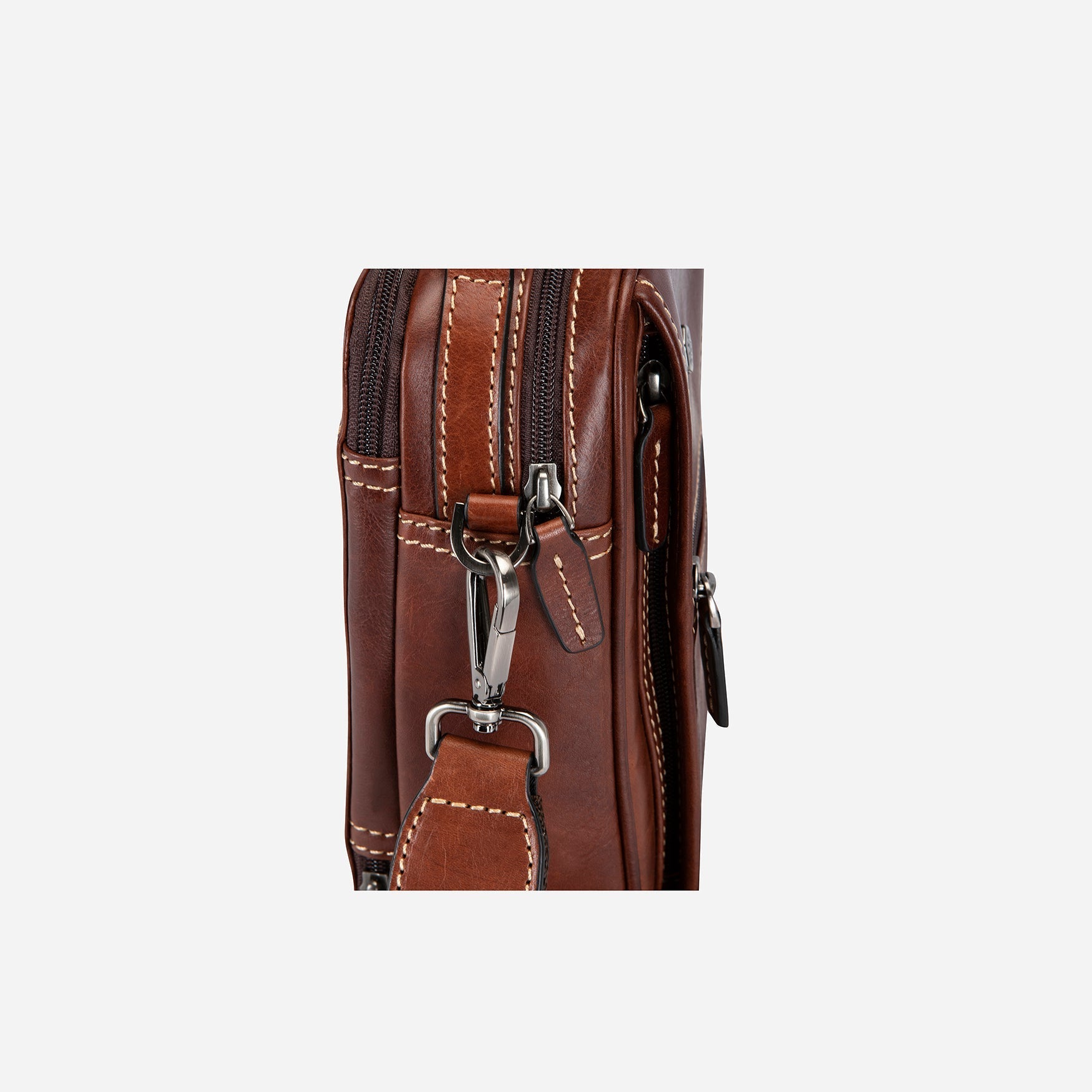 Stylish tobacco crossbody bag with adjustable strap and spacious interior.