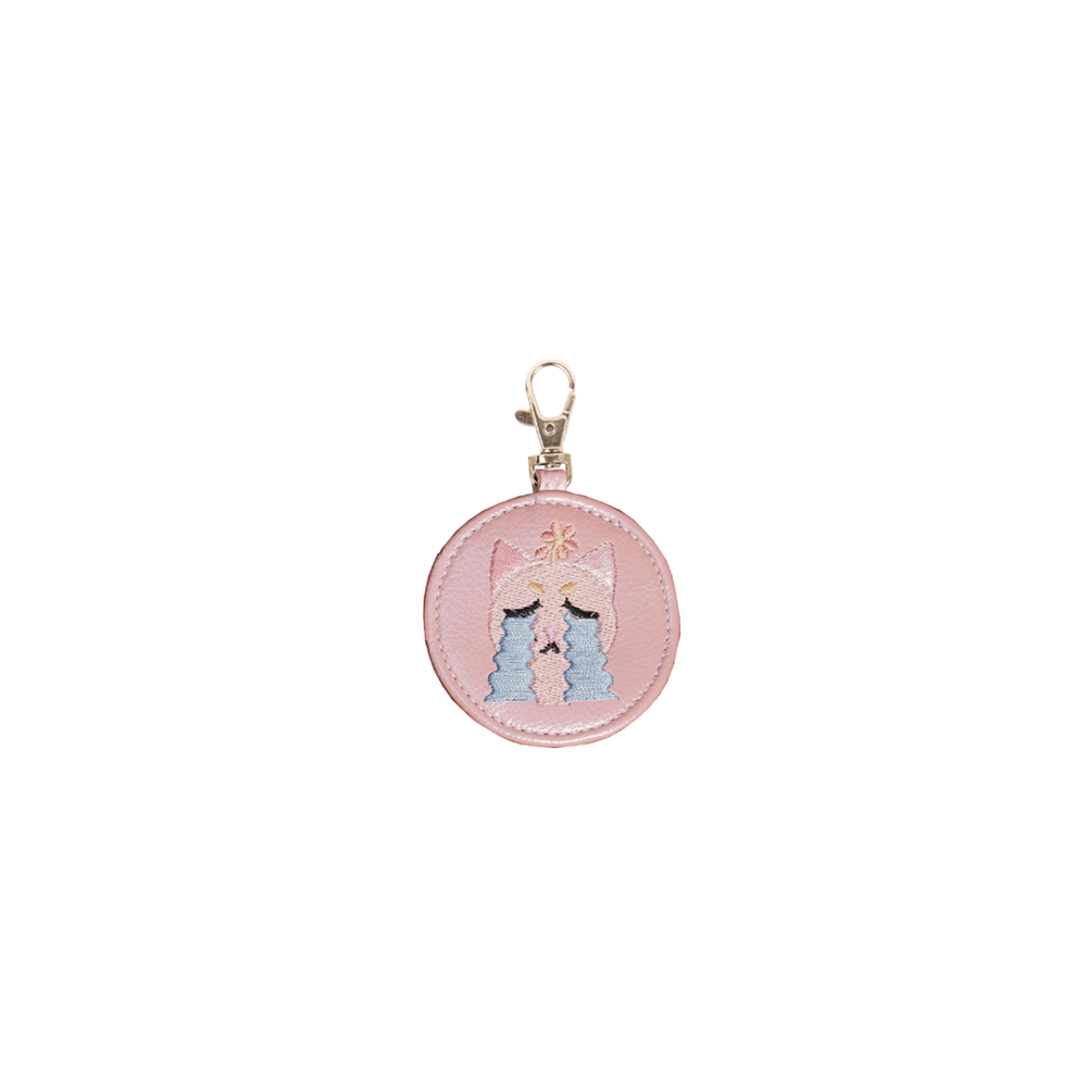 Crying Cat Bag Charm featuring an adorable cat with a crying expression, perfect for cat lovers.