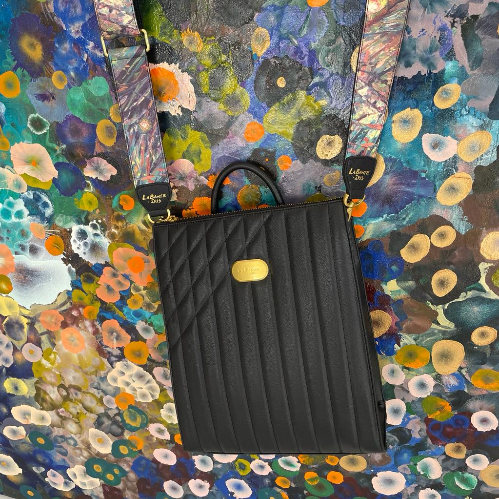 Danai Backpack in Black featuring Iris Scott's impressionist designs, showcasing its stylish straps and spacious compartments.