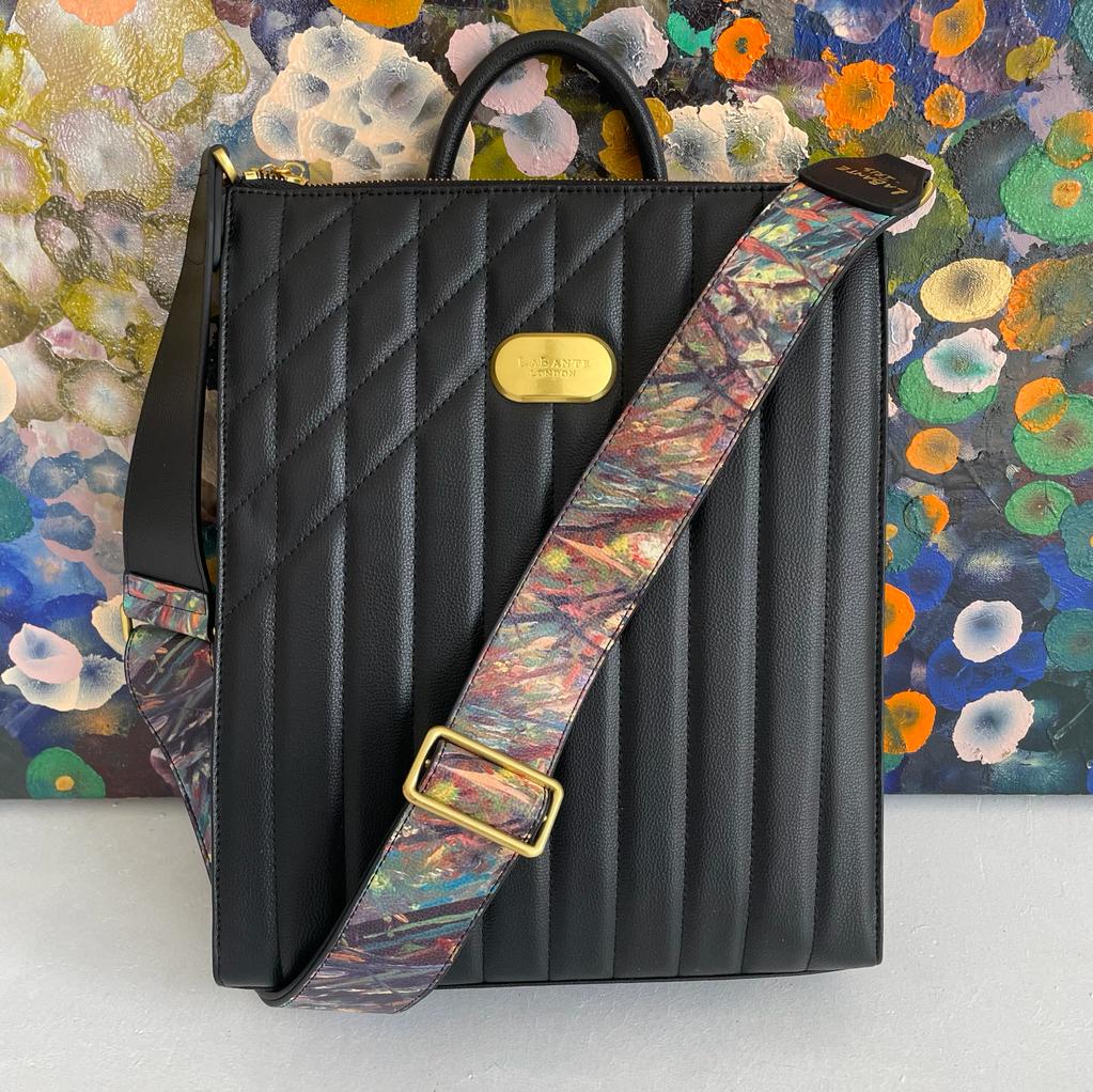 Danai Backpack in Black featuring Iris Scott's impressionist designs, showcasing its stylish straps and spacious compartments.