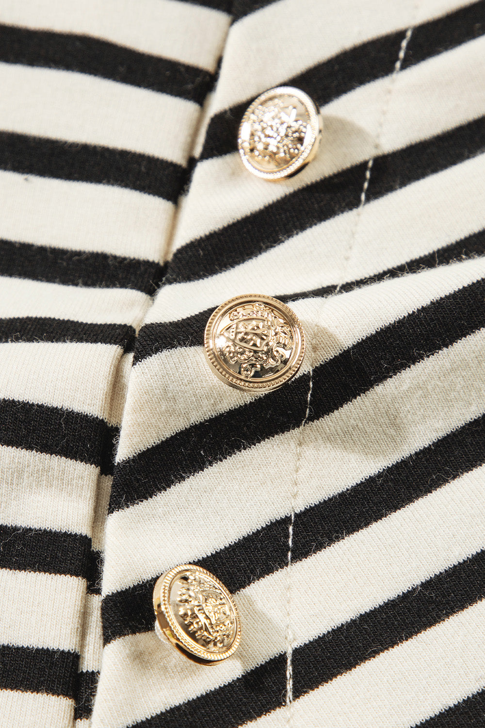 A stylish Decorative Button Striped Long Sleeve Sweatshirt featuring decorative buttons, soft fabric, and a trendy striped pattern.