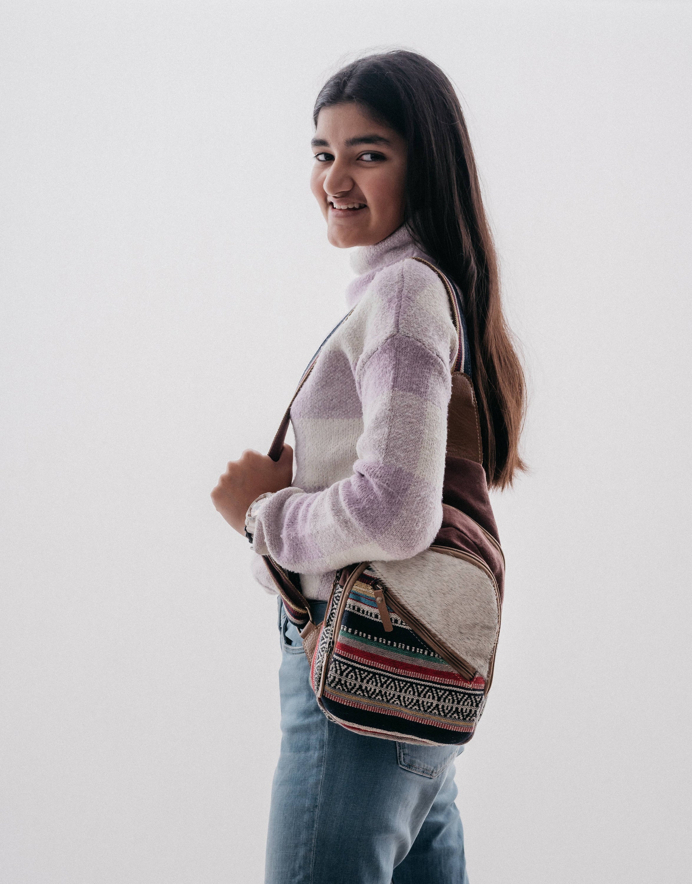 Dedio Fanny Pack made of cotton fabric, hairon, canvas, and leather, featuring multiple zippered pockets for storage.