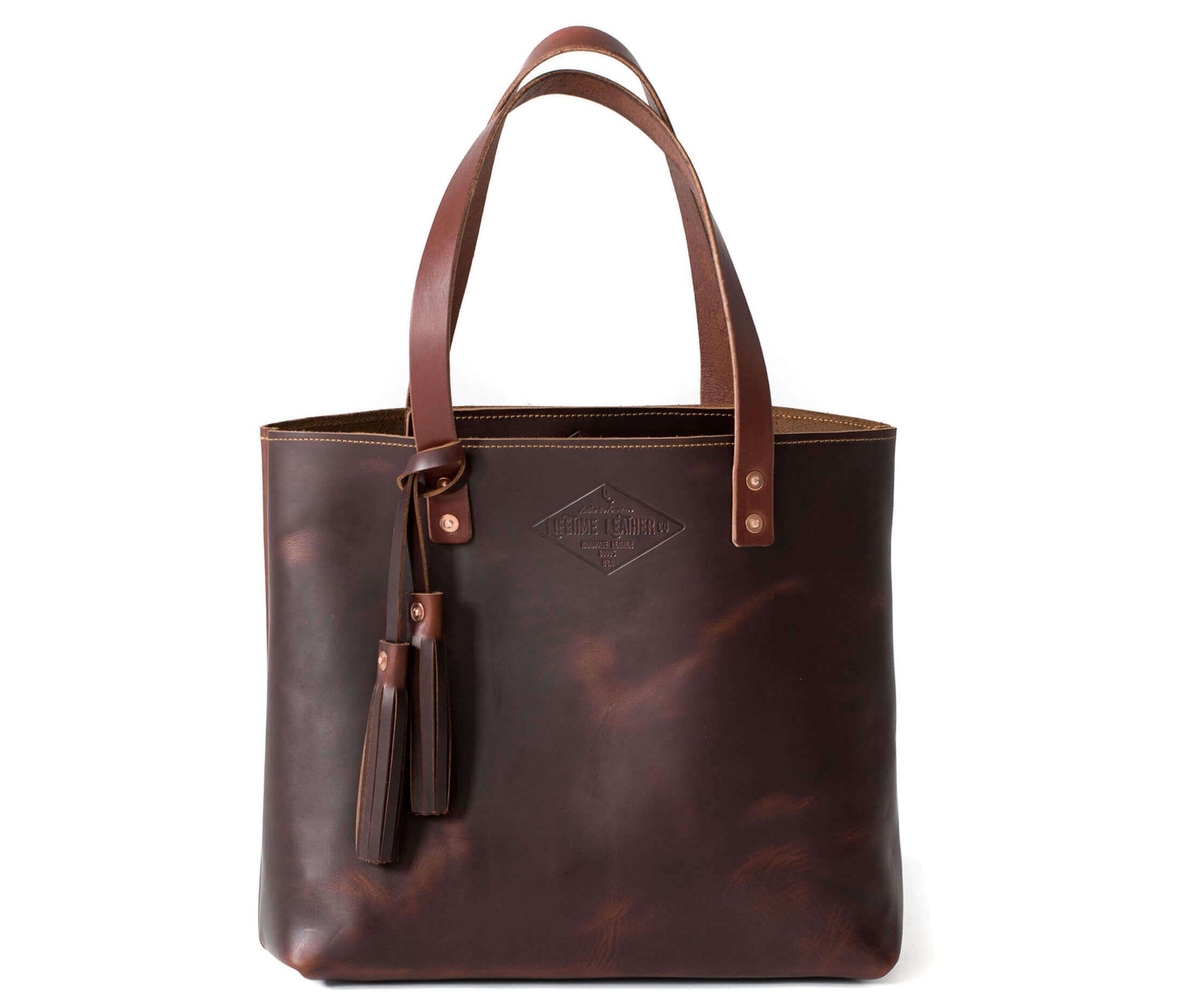 Deluxe Lifetime Tote in premium dyed leather, spacious design with interior pockets, perfect for everyday use.