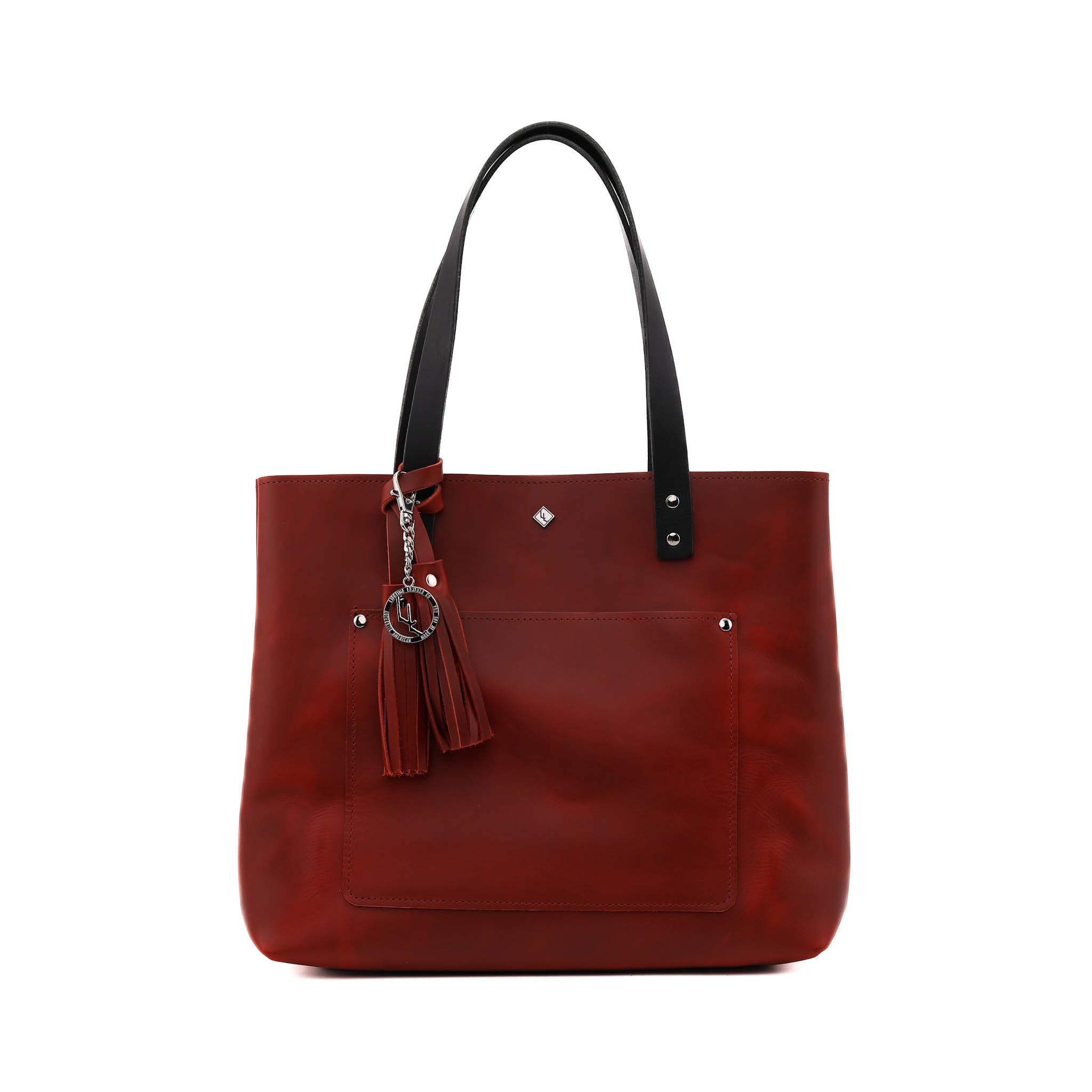 Deluxe Lifetime Tote in premium dyed leather, spacious design with interior pockets, perfect for everyday use.