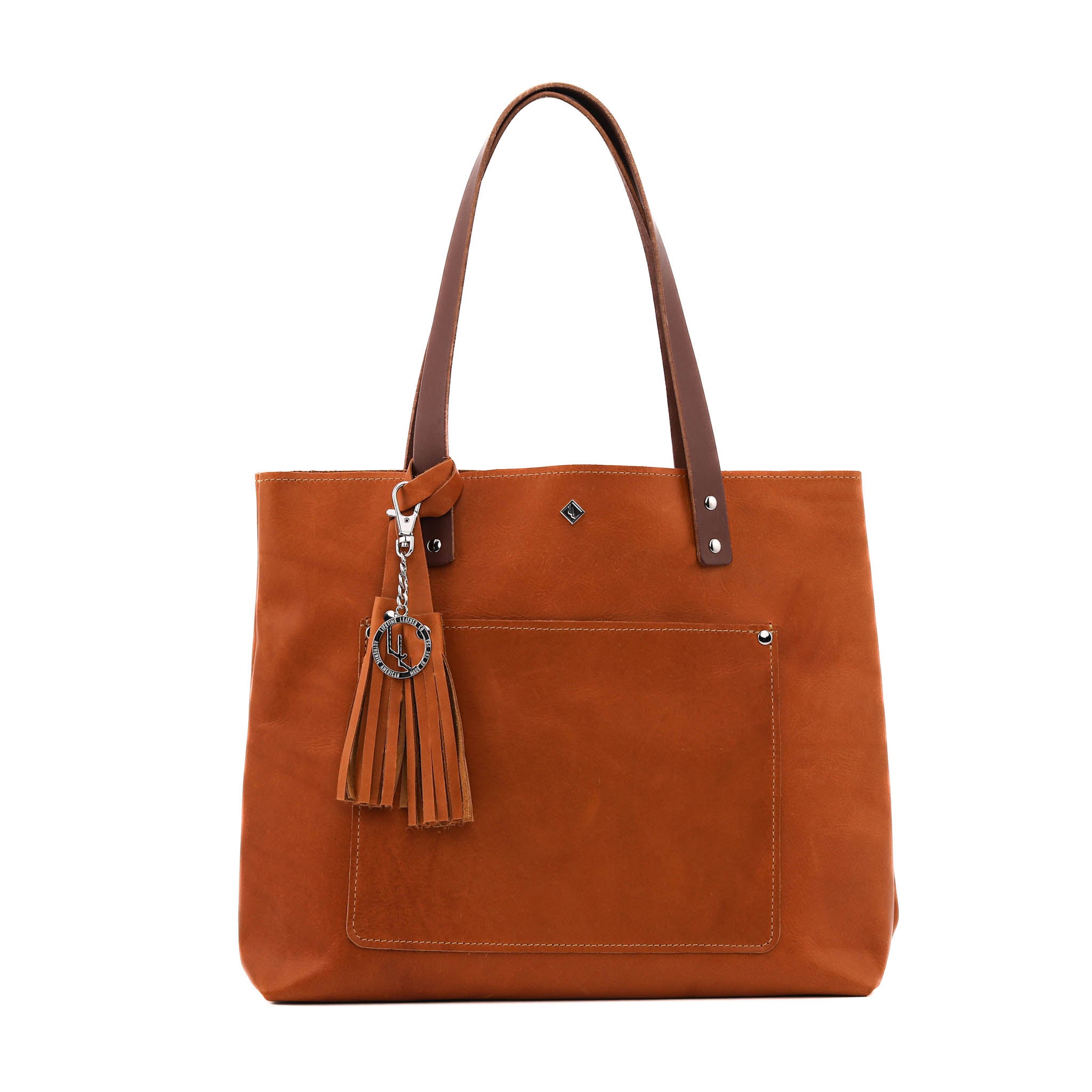 Deluxe Lifetime Tote in premium dyed leather, spacious design with interior pockets, perfect for everyday use.