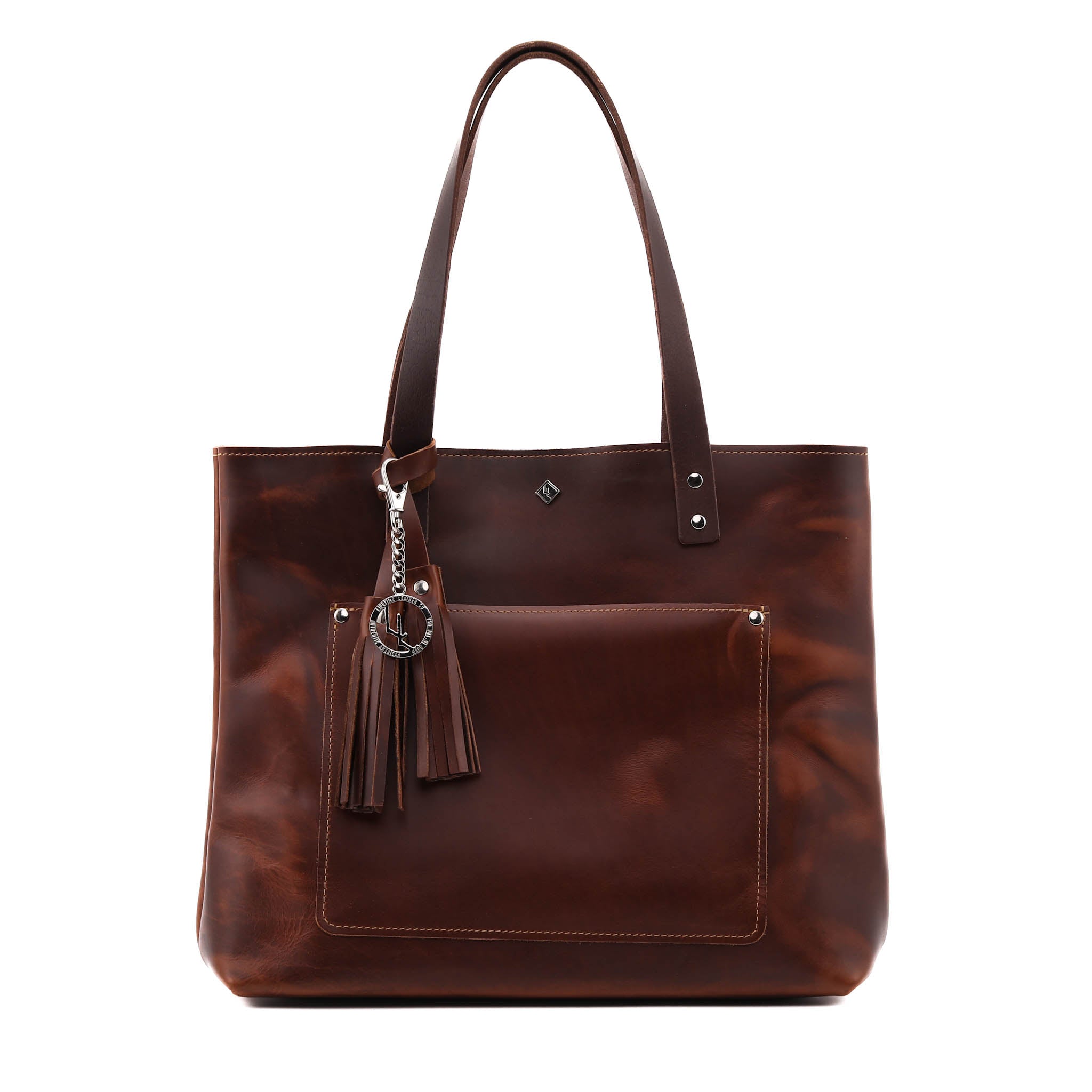 Deluxe Lifetime Tote in premium dyed leather, spacious design with interior pockets, perfect for everyday use.