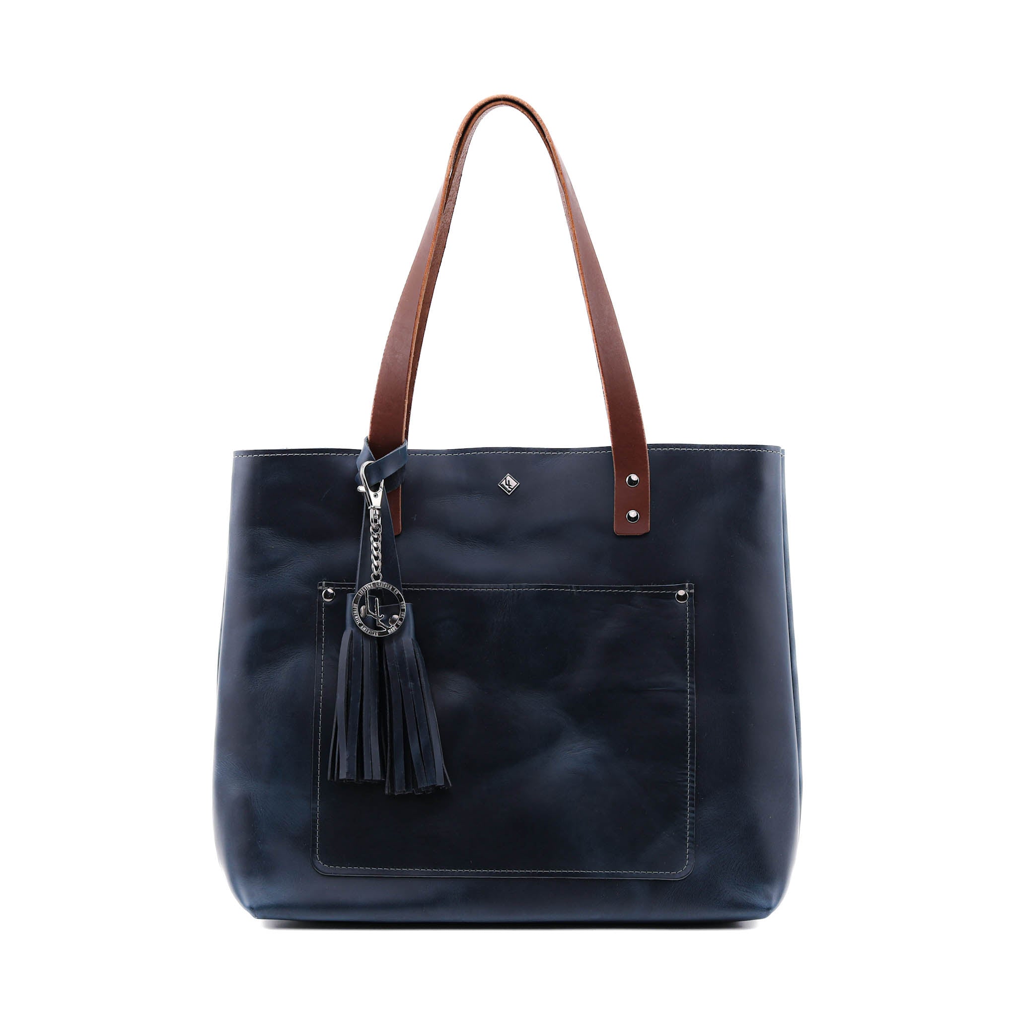 Deluxe Lifetime Tote in premium dyed leather, spacious design with interior pockets, perfect for everyday use.