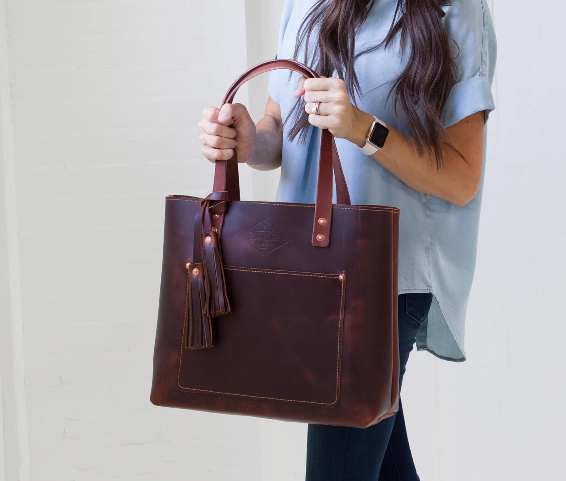 Deluxe Lifetime Tote in premium dyed leather, spacious design with interior pockets, perfect for everyday use.