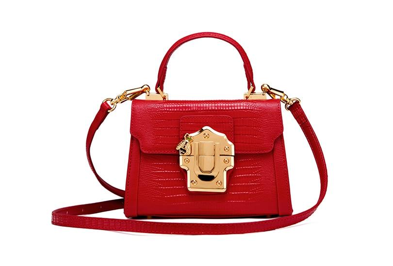 Designer Serpentine Lock Handbag made of split leather, featuring a stylish serpentine pattern and lock decoration, available in multiple colors.