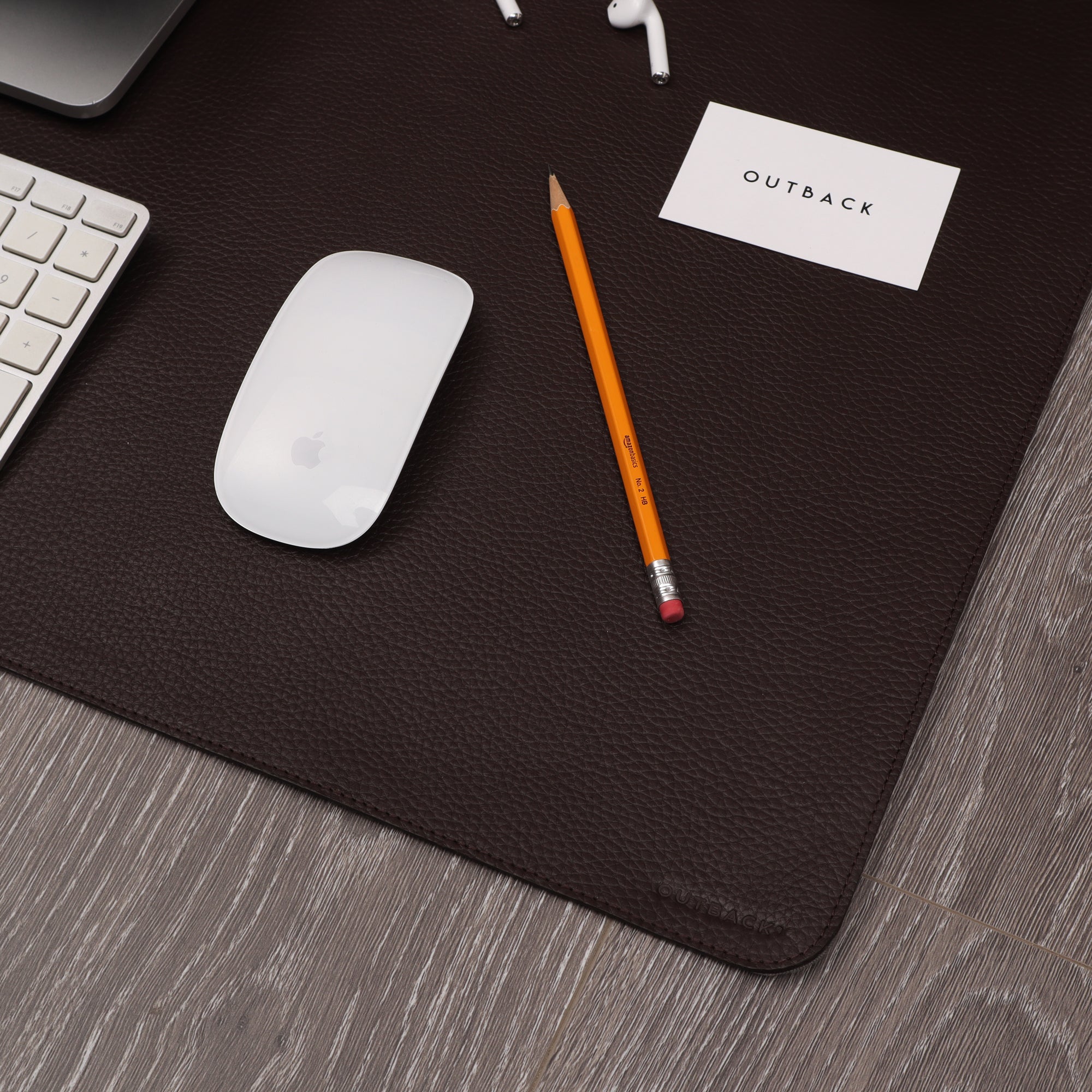 A luxurious desk mat made from premium full grain leather, featuring a smooth surface and burnished edges, perfect for enhancing workspace aesthetics.