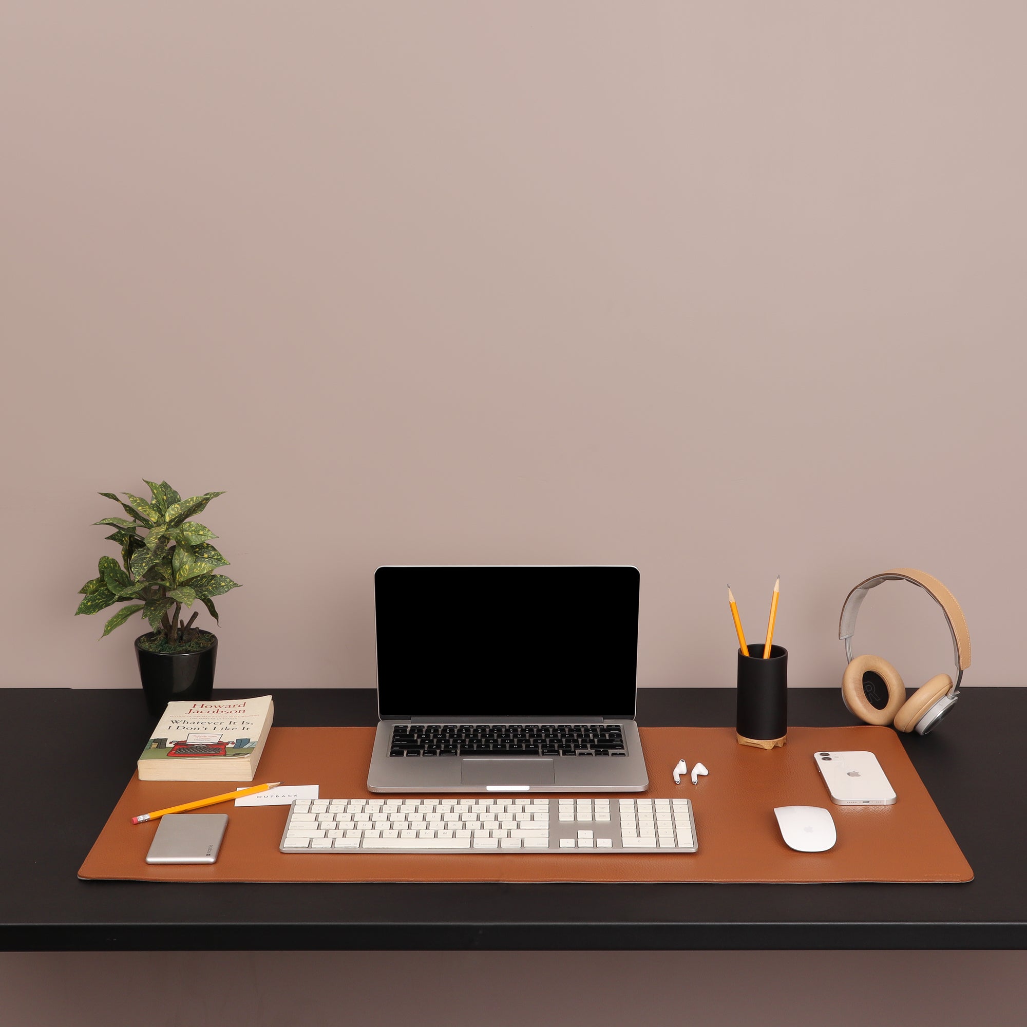 A luxurious desk mat made from premium full grain leather, featuring a smooth surface and burnished edges, perfect for enhancing any workspace.